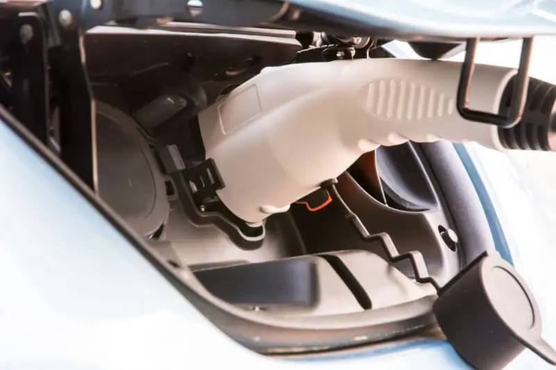charger plugged into an electric car