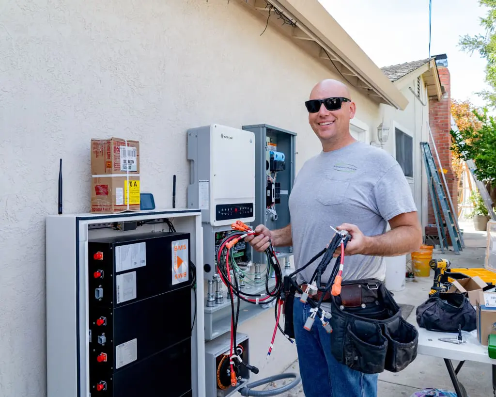 Technician installing commercial solar electrical equipment